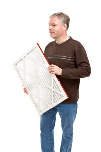 man-holding-furnace-filter